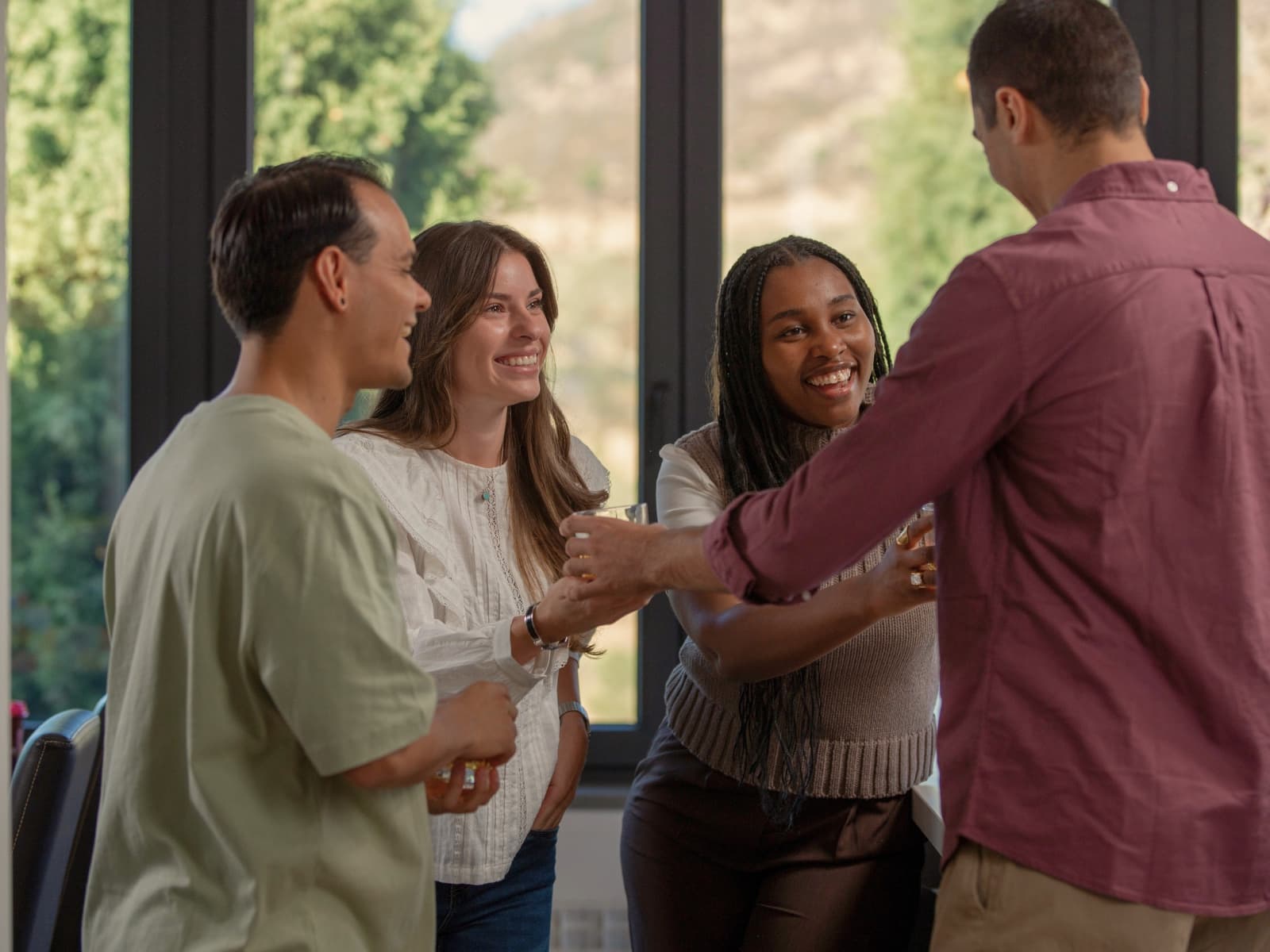 A diverse group welcoming one another into community